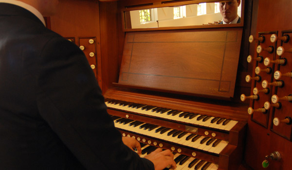 A 51̳ University student practicing the organ.